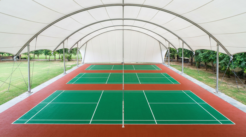 Curved tensile membrane roof spanning badminton courts on slender steel masts (visualization)