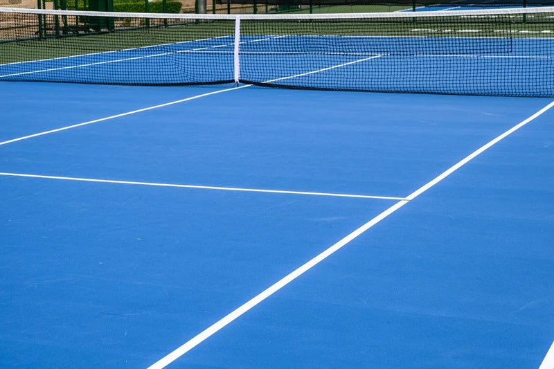 Full ITF-spec acrylic tennis court with run-off — turnkey installation