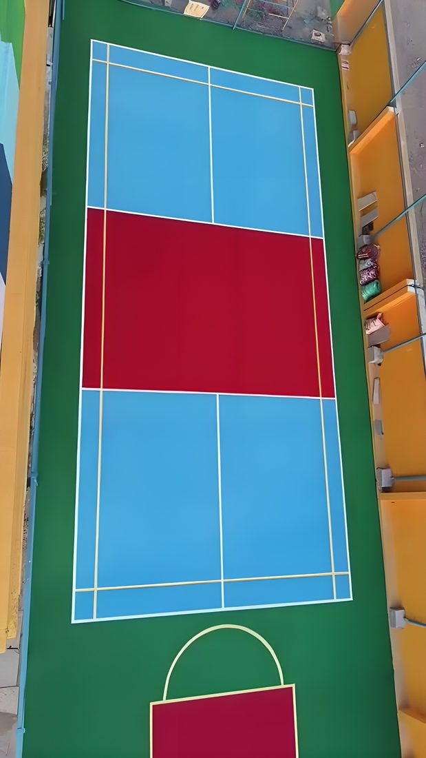 Top-down view of finished badminton court at a school in Hyderabad