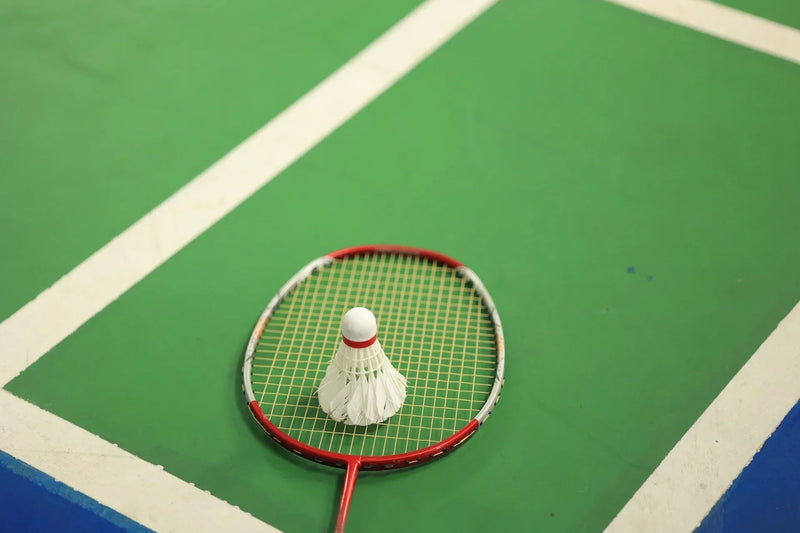 Acrylic badminton court with nets and posts installed — BWF-spec line marking