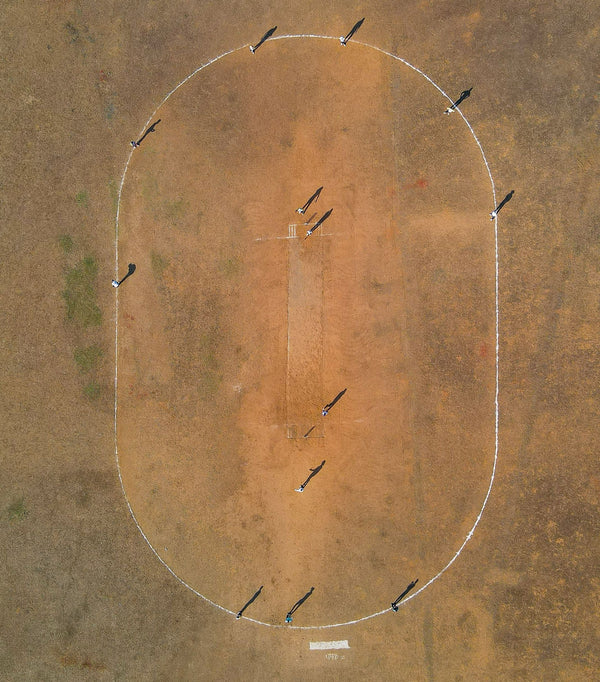 A Cricket Pitch Between the Buildings