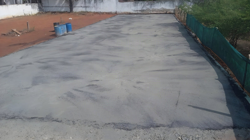 Freshly laid court base bed with shade-net perimeter — ChampCourts project, Sivakasi