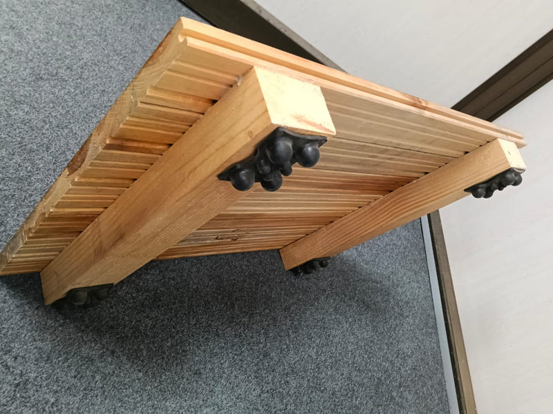 Teak air-cushion sprung flooring panel with finished playing surface on a shock-absorbing base