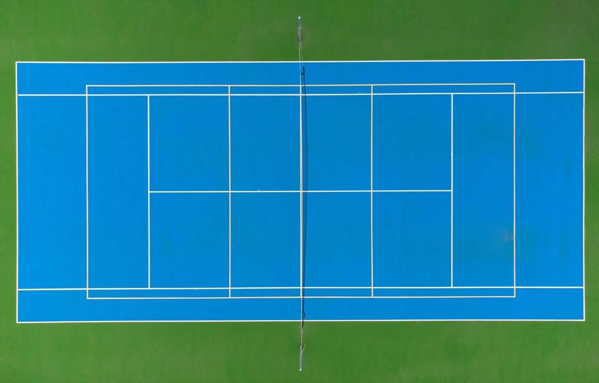 Drone aerial of acrylic tennis court — pan-India construction