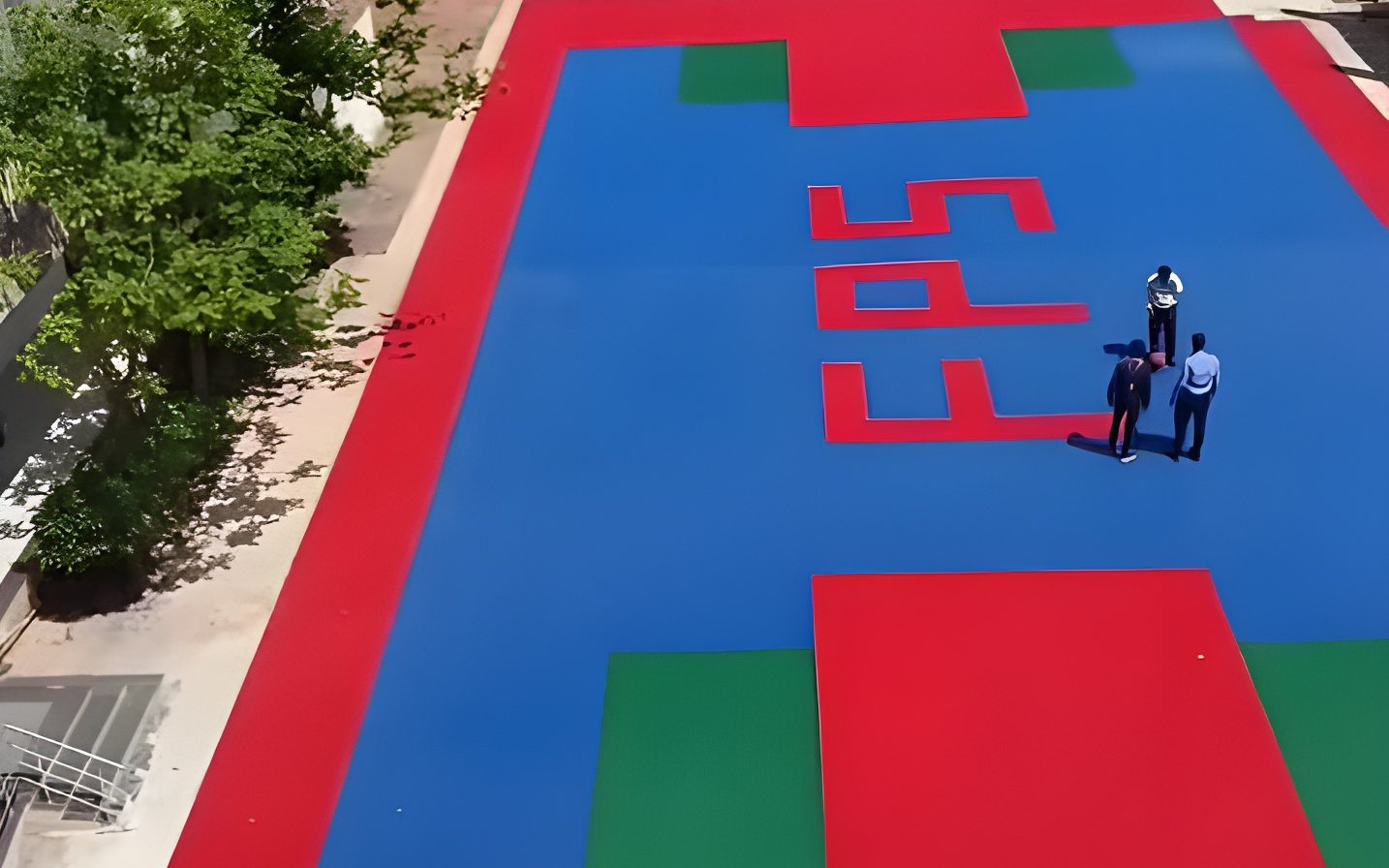 Finished multi-sport court with custom school branding at a school in Sangola, Maharashtra