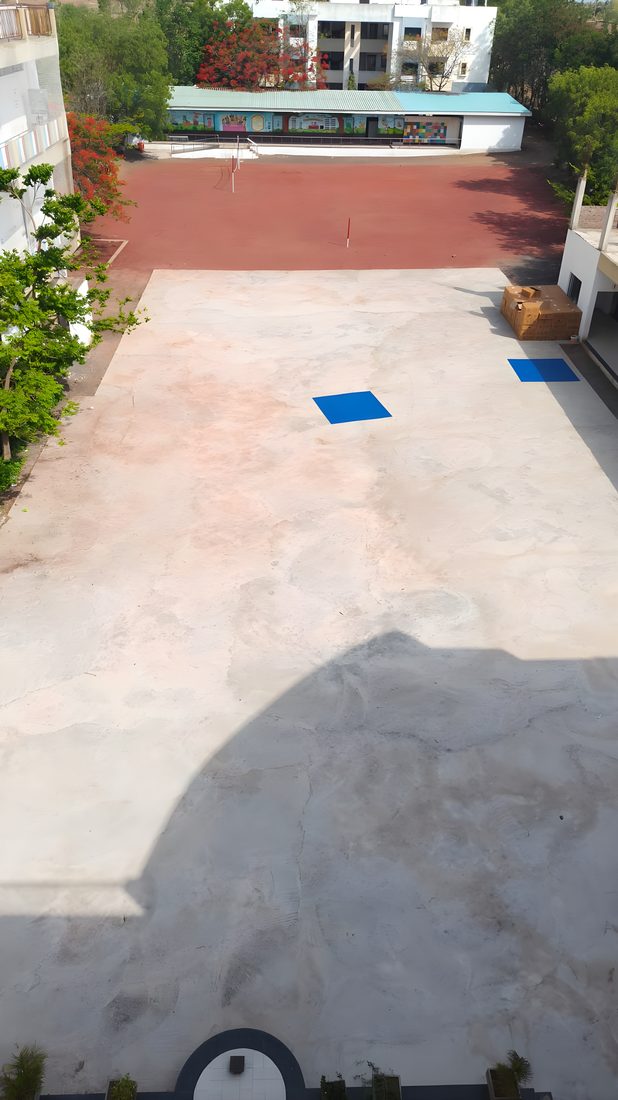 School courtyard before construction — bare concrete base, Sangola, Maharashtra
