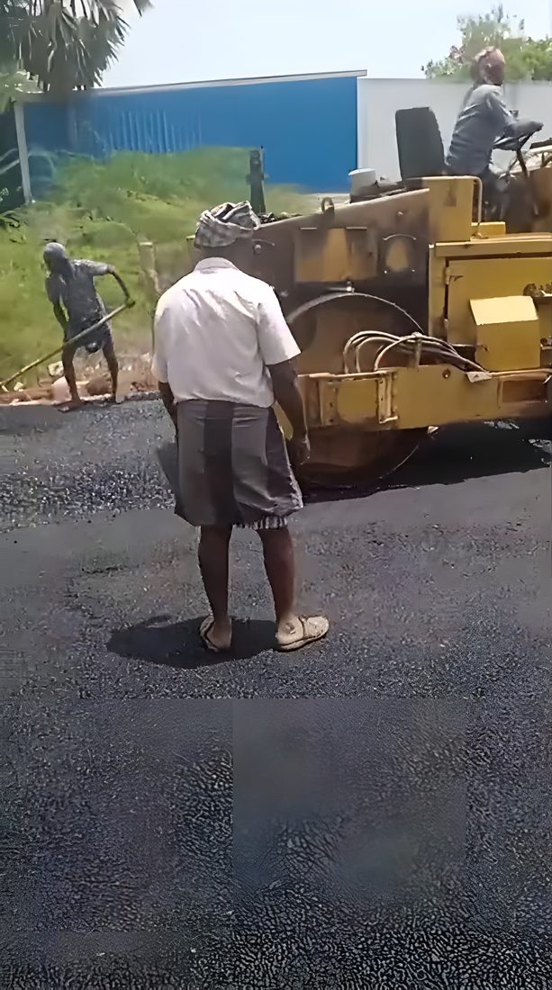 Tar application in progress for an asphalt court base
