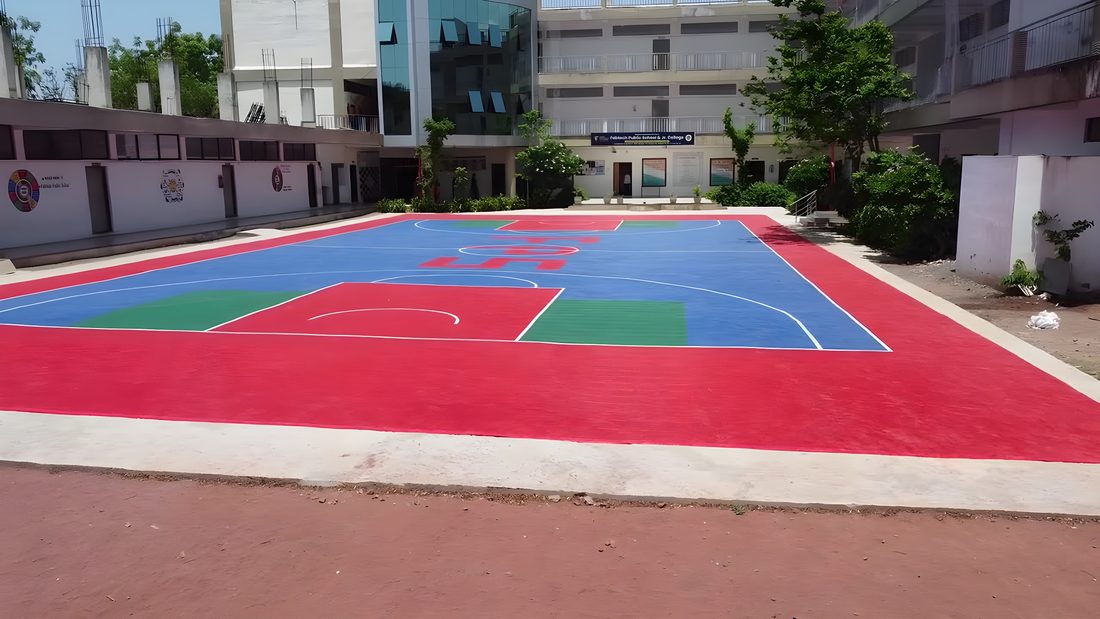 Basketball key and fresh court markings on a finished school court surface