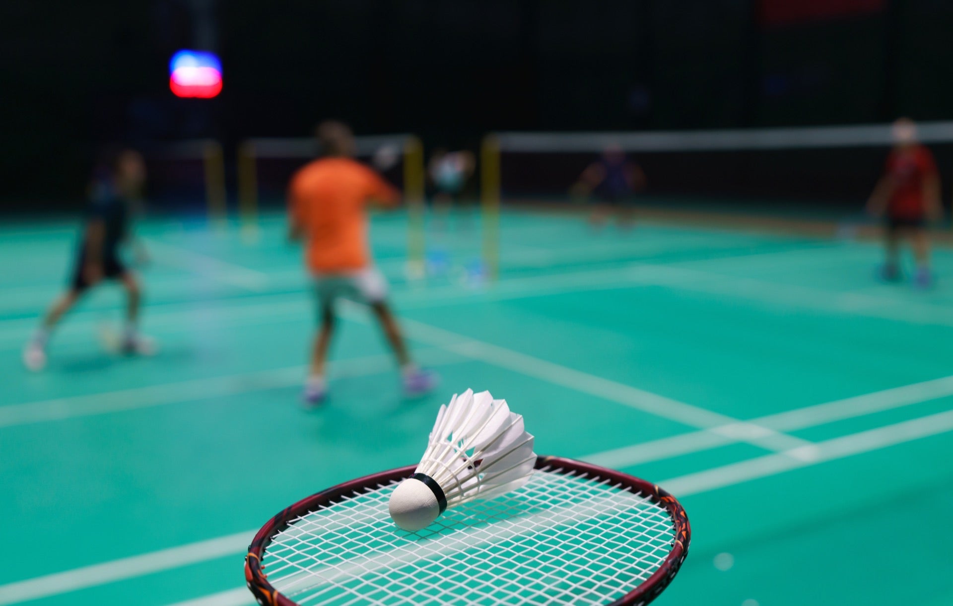 Court 1 in Green PP tiles — badminton at a Pune residential society