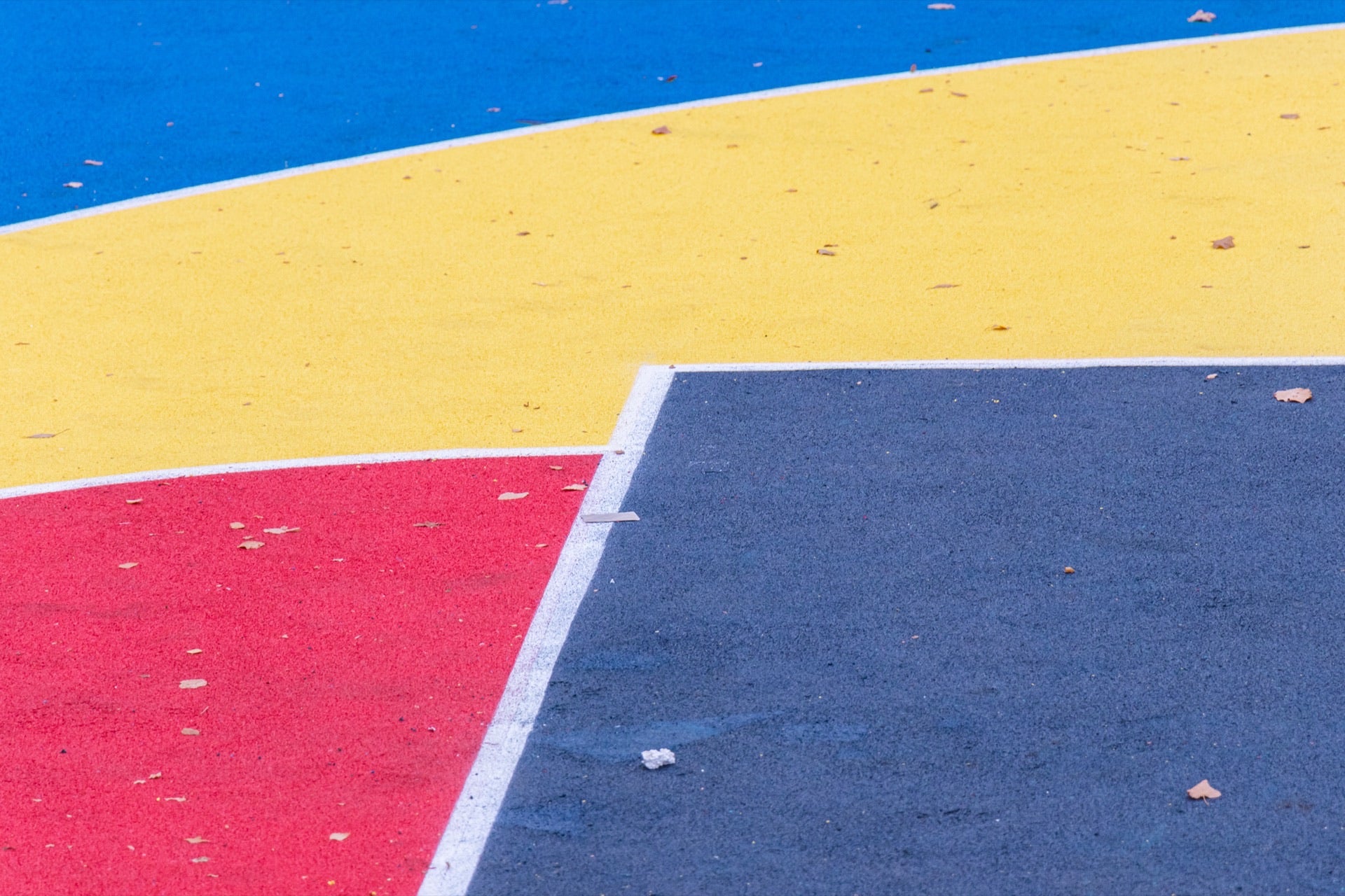 Existing cracked earth play area before EPDM installation