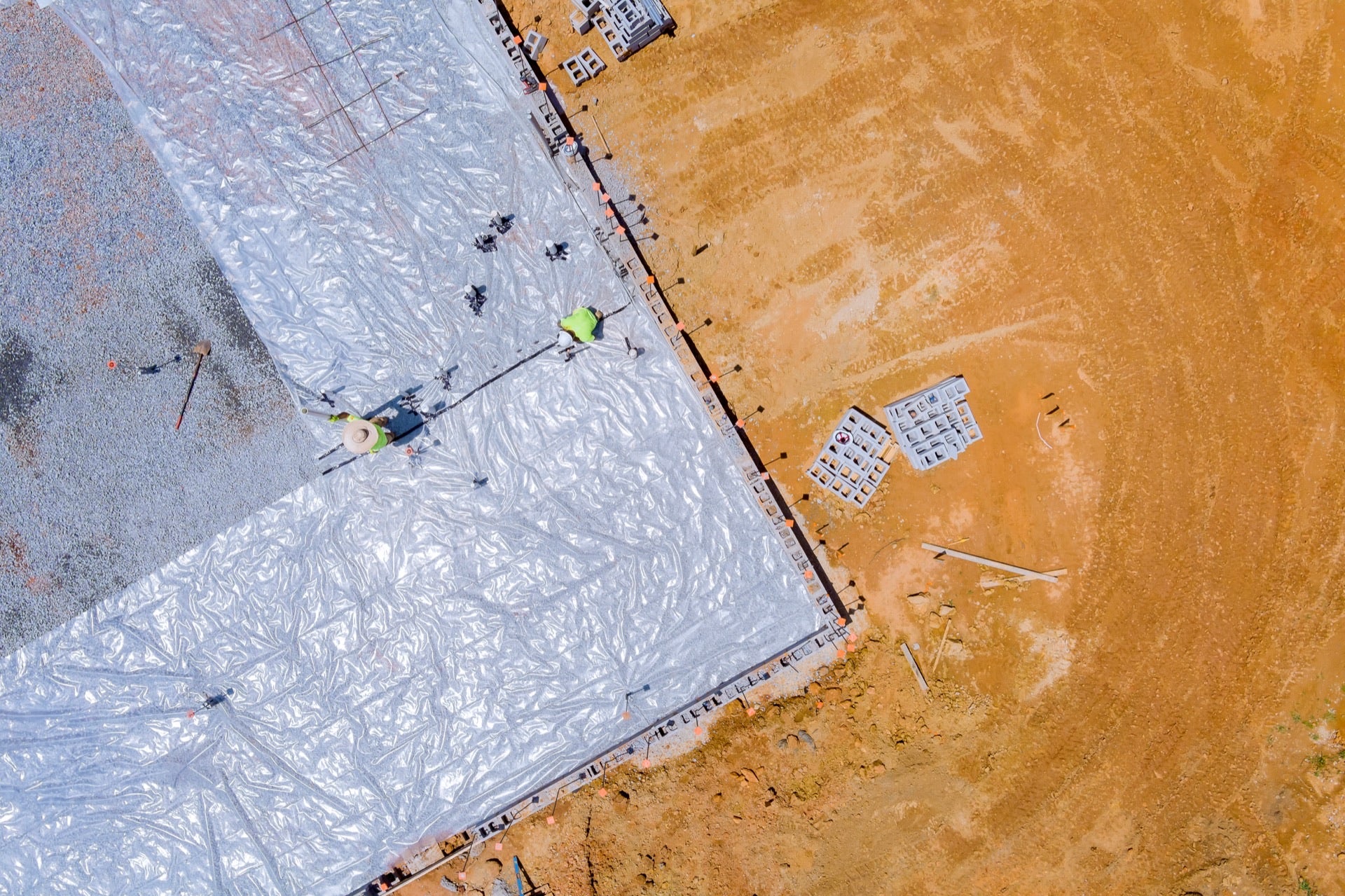 Green tiles being installed on Court 1
