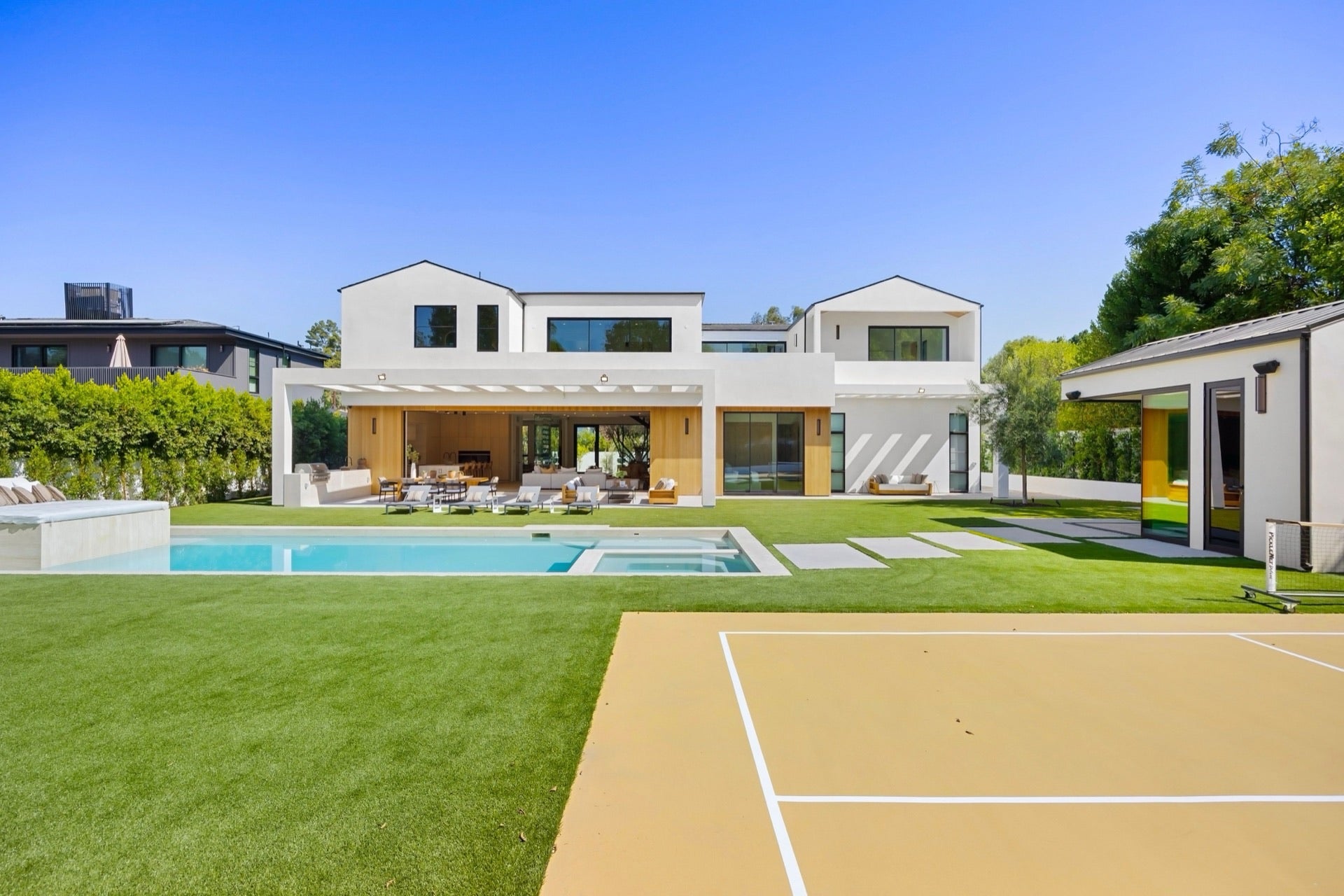Completed courts under floodlights at dusk