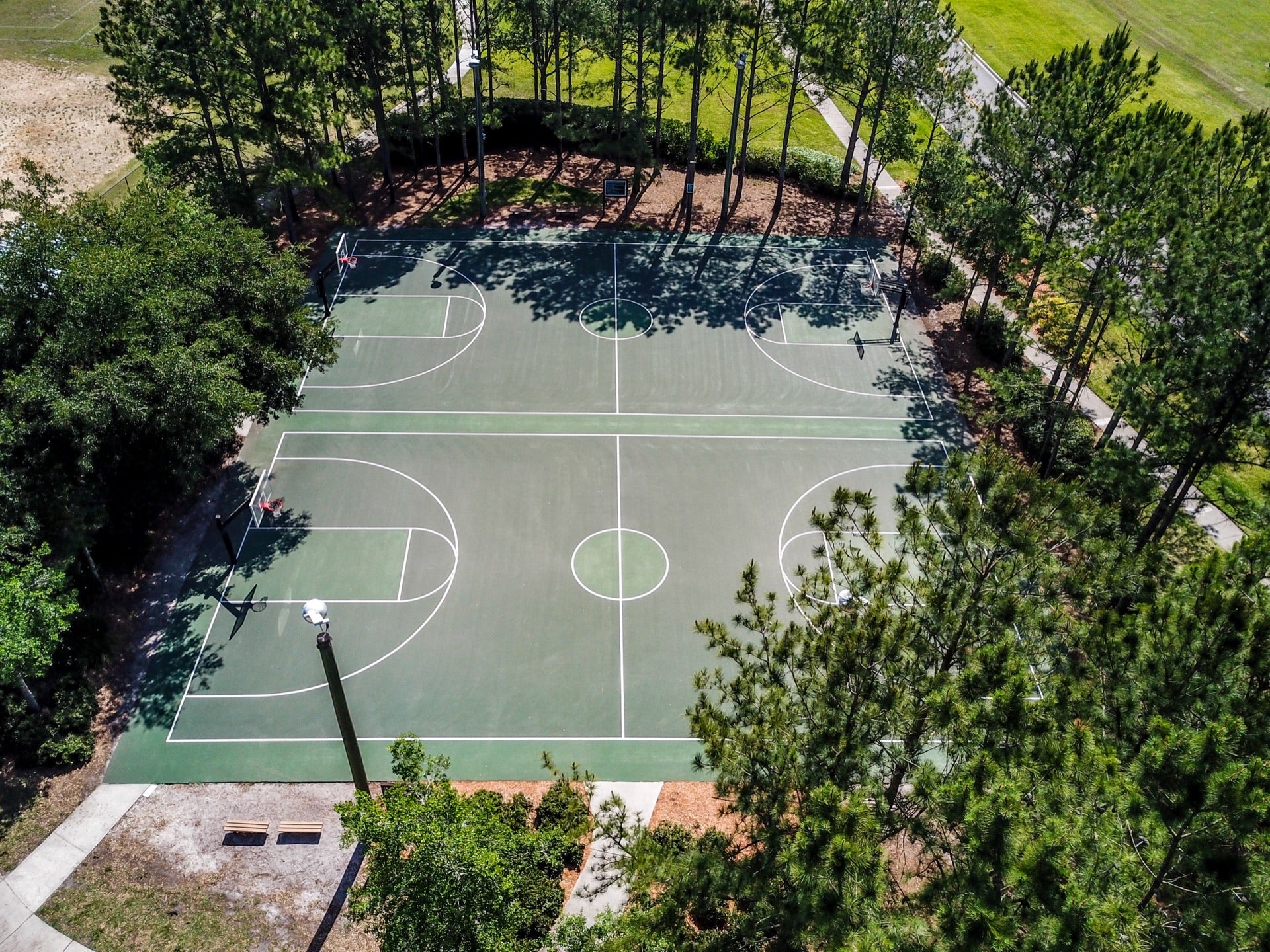 Both completed badminton courts side by side